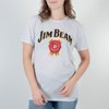 White t-shirt with Jim Beam written in black on the top, with a red symbol under it. A woman is wearing the shirt.