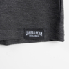 Close-up of the shirt's tag. A black rectangle with “James B. Beam” written in white.