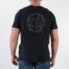 Back of the black t-shirt. A gray circle with “Baker’s single barrel” written inside the circle. Man is wearing the shirt.