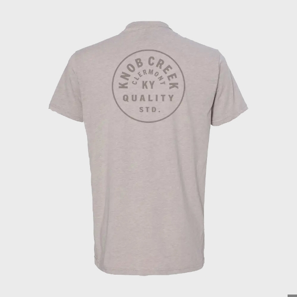 Back view of shirt. A grey circular design that spells “Knob Creek, Clermont, KY, Quality SDT.