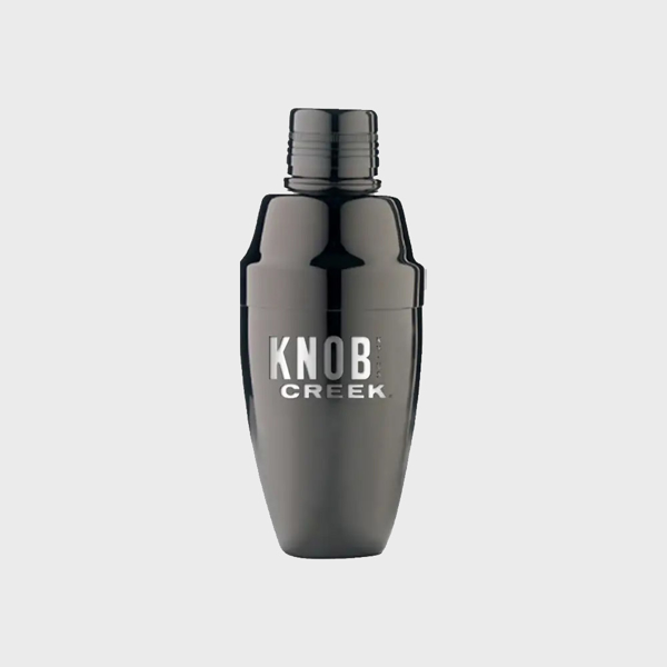 A cocktail shaker in the color black, with “Knob Creek” written in the middle with white letters.