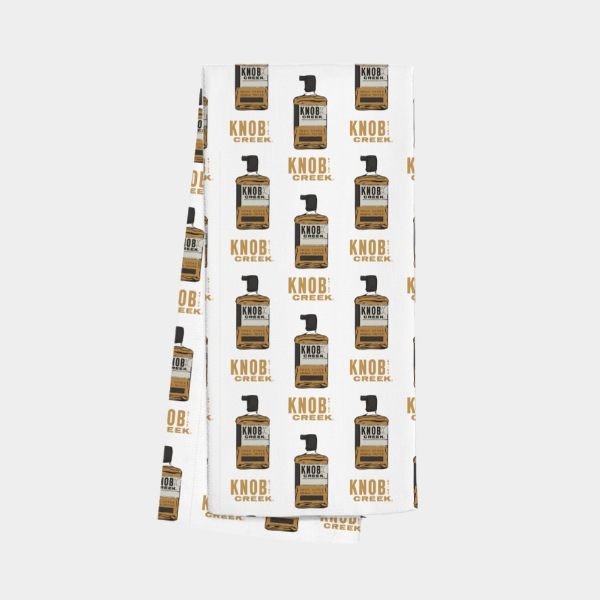 White bar towel with repeating Knob Creek bourbon bottle pattern
