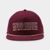 Front view of the Knob Creek Burgundy Canvas Cap with cream and gold embroidered logo and gold rope detail above the visor.
