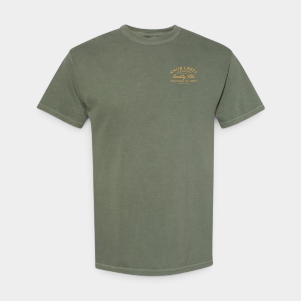 Front view of the Knob Creek Heavyweight T-Shirt in moss green with a gold Knob Creek Bourbon Whiskey graphic on the left chest.