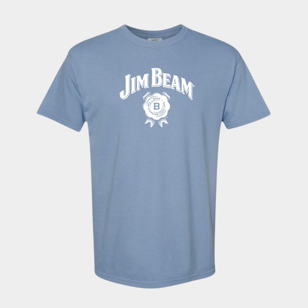 Front view of the Jim Beam Heavyweight T-Shirt in washed denim blue with a white Jim Beam logo and seal graphic centered on the chest.