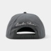 Back view of the Booker’s Grey Cap with perforated panels, adjustable snapback closure, and white Booker Noe signature embroidery.